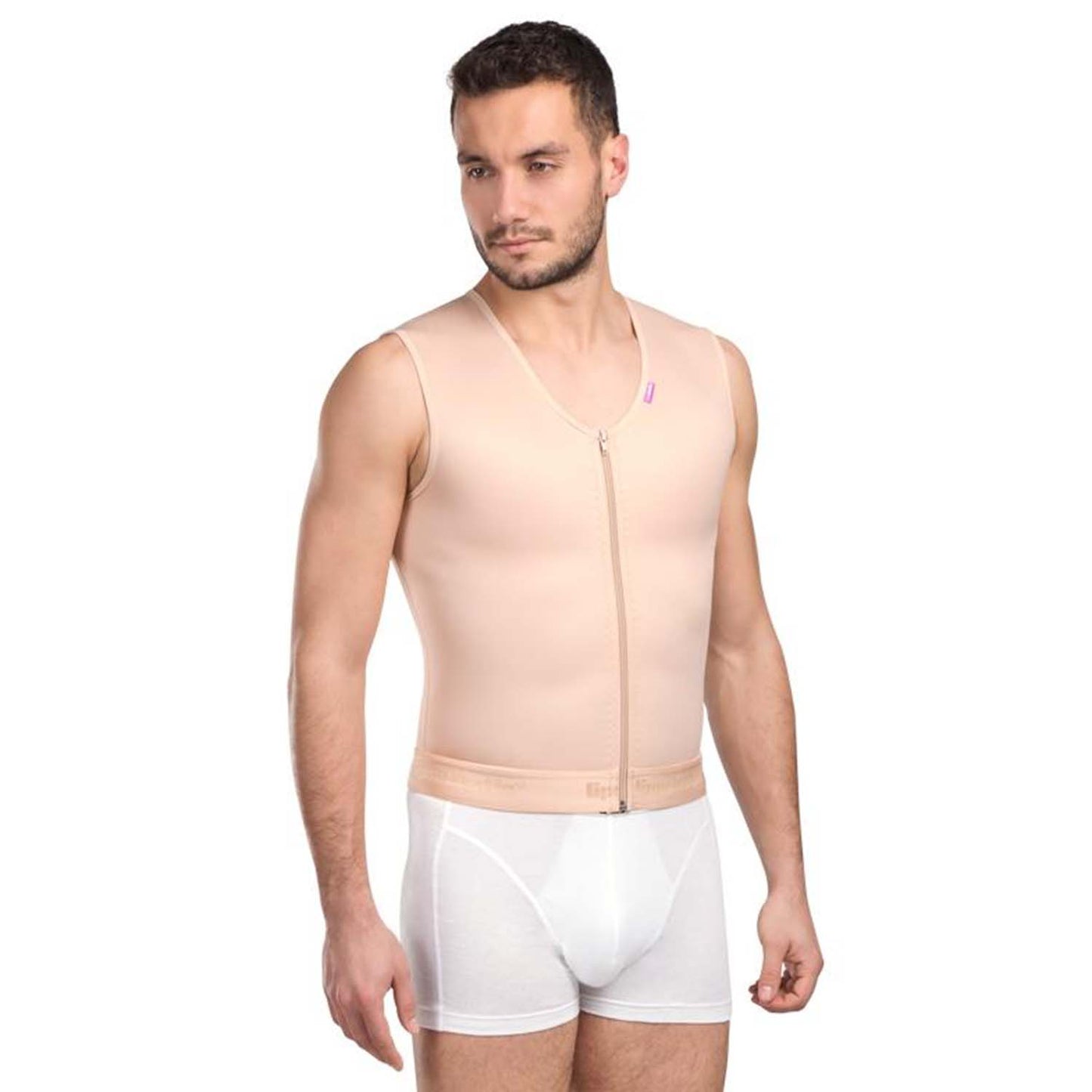Angled view of man wearing beige Lipoelastic MTm Comfort men’s gynecomastia post-op compression vest