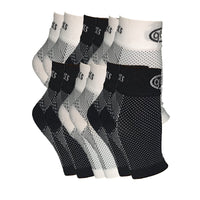 6-pack of GBM mmHg Compression Foot Sleeves with three black and three white sleeves for stylish support.