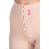 Close-up of Lipoelastic TB Variant nude compression pants with front hook-and-eye fastening and hygienic opening.