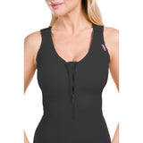 Woman wearing Lipoelastic MH Special Comfort compression bodysuit in black, front view close-up